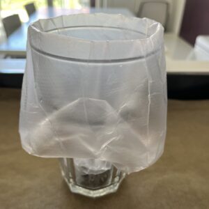 a piping bag open in.a tall glass